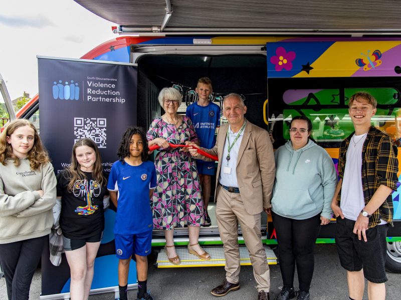 Cllrs Maggie Tyrrell and Sean Rhodes cutting the ribbon to launch the bus, with members of the South Gloucestershire Youth Board